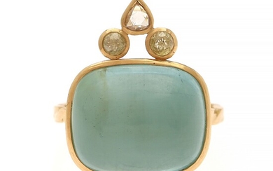 NOT SOLD. Natascha Trolle: An aquamarine and diamond ring set with a cabochon aquamarine flanked...