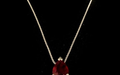 PENDANT in white gold adorned with a pear cut ruby...