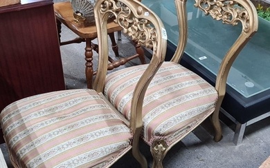 Pair of French-style carved gilt wood chairs with striped up...
