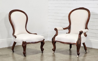 Pair of Gent's & Lady's carved walnut chairs, upholstered in...