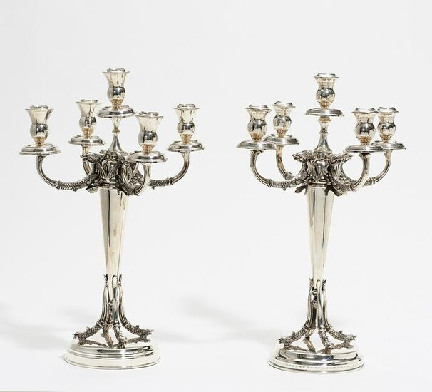 Pair of splendid silver candelabra with dolphin decor