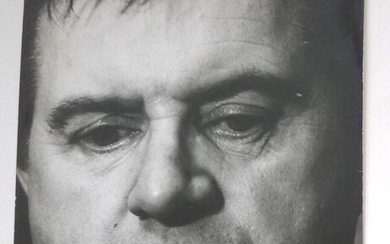 Portrait of Francis Bacon. Original gelatin print by Jorge Lewinski. Circa 1967. Studio stamp of the photographer, 'Francis Bacon' added in blue ink. 195x248mm.