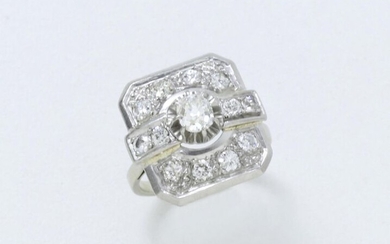 Ring in 750 white gold and 850 thousandths platinum, octagonal in shape, centered on an antique cut diamond in claw setting set on a pavement of brilliant diamonds. French work circa 1930.