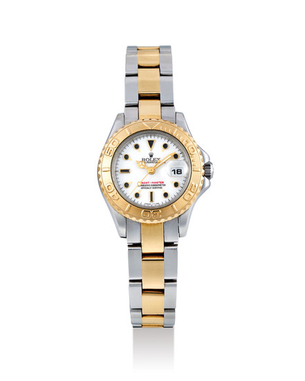 Rolex. A Lady's Yellow Gold and Stainless Steel Wristwatch with Bracelet and Date