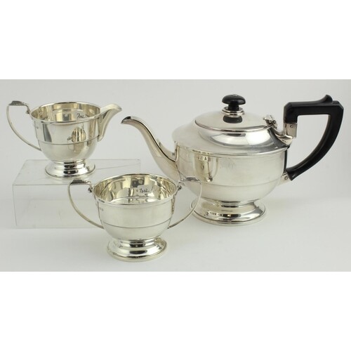 Silver three piece tea set comprising teapot, sugar bowl and...