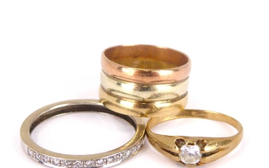 Three 9ct gold rings comprising a triple three-colour band ring,...