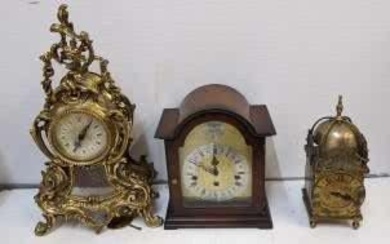 Three clocks, a 20th century lantern clock, an Indian...