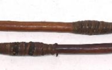 Two Aboriginal wooden spears, both with barbed sections, and bound...