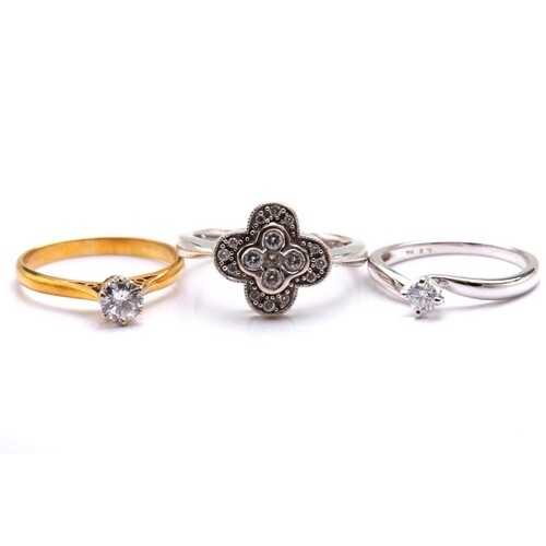 Two diamond solitaire rings and a diamond cluster ring; To i...