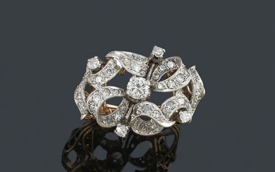 Ring with fretted motifs sprinkled with brilliant and