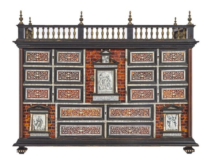 238-Beautiful cabinet in veneer, ebony and blackened wood veneer of tortoiseshell, bone and ivory with religious scenes flanked by small columns and architectural motifs, it opens to a central door that conceals three drawers and ten drawers and two...