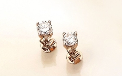 Pair of 14 kt gold earrings with...