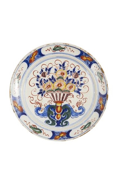 38-Delft: a polychrome earthenware plate with a flowered basin. Wing...