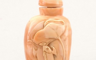 CHINESE CARVED PINK SHELL SNUFF BOTTLE In comma form, with lotus leaf and carp carving. Height 3". Conforming stopper.