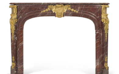 A FRENCH ORMOLU-MOUNTED ROUGE GRIOTTE MARBLE FIRE-SURROUND, OF LOUIS XV STYLE, LATE 19TH/ EARLY 20TH CENTURY