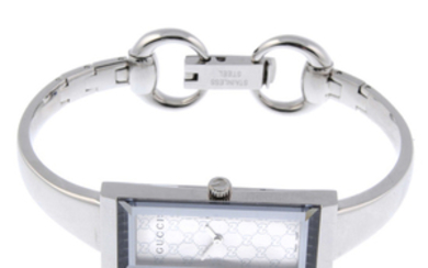 GUCCI - a lady's stainless steel 127.5 bracelet watch with two Gucci watches.