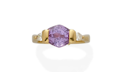 A purple sapphire, diamond and 18k gold ring