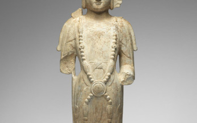 A rare carved limestone figure of a bodhisattva