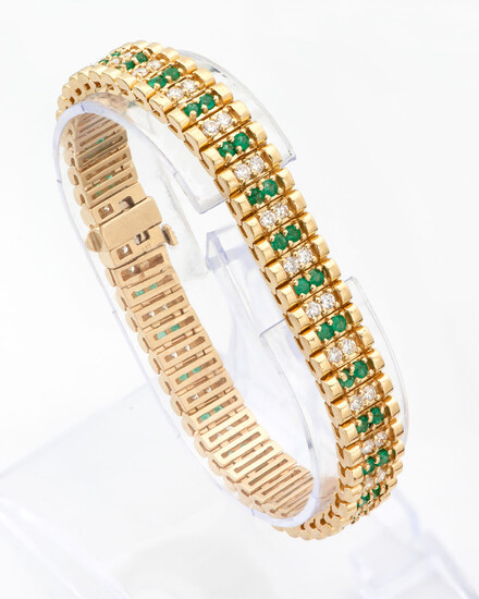 A 14 Karat Gold Diamond and Emerald Tennis Bracelet