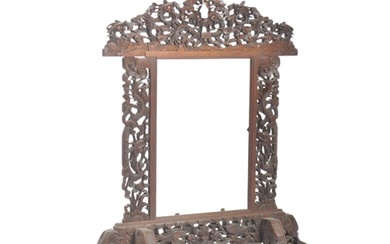 A 19th century Chinese hardwood screen. Heavily carved and d...