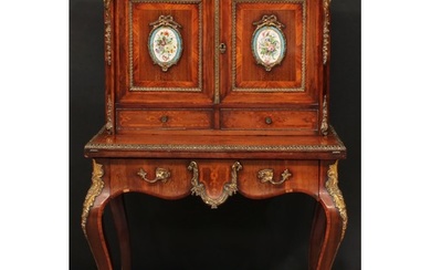 A 19th century porcelain and gilt metal mounted kingwood ban...