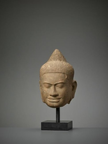 A BAYON STYLE LIFESIZE HEAD OF BUDDHA LATE 12TH CT