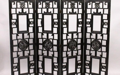 A CHINESE BLACK LACQUER FOUR SECTION CARVED WOOD