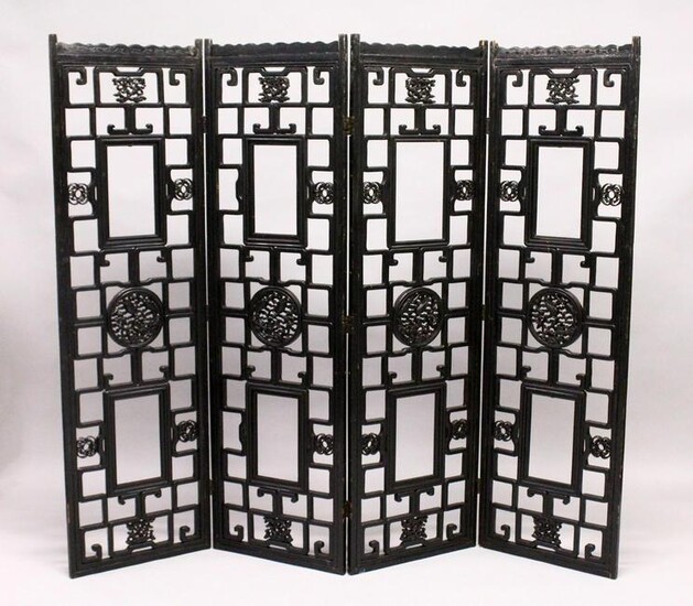 A CHINESE BLACK LACQUER FOUR SECTION CARVED WOOD