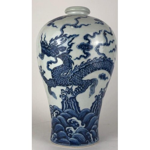 A CHINESE BLUE AND WHITE BALUSTER VASE Decorated with a four...