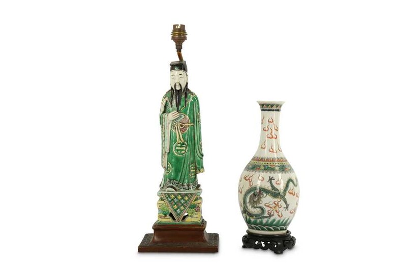 A CHINESE FAMILLE VERTE BISCUIT FIGURE AND A 'DRAGON' VASE.