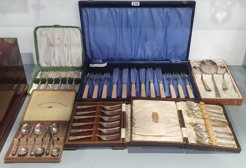 A COLLECTION OF CASED SILVER PLATED CAKE FORKS AND COFFEE SPOONS including a cased set of fish knives and forks with silver ferrules