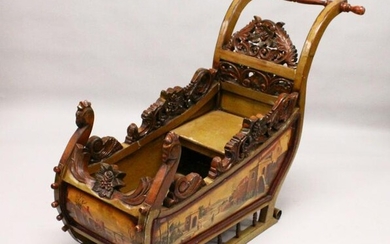 A CONTINENTAL CARVED AND PAINTED SLEIGH, each side