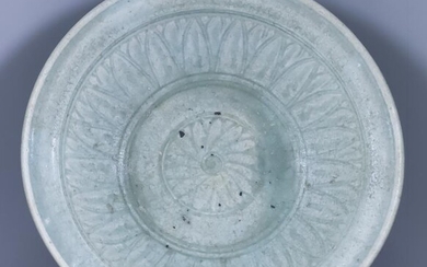 A Chinese Celadon Dish, the centre with incised flower...