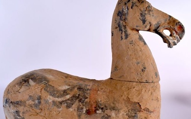 A Chinese Grey Pottery Horse with much of the original painted decoration under earth encrustation.