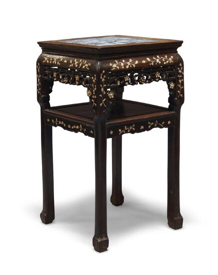 A Chinese hardwood square table, early 20th century, the top inset with marble panel above carved and mother-of-pearl inlaid frieze, raised on square legs united by an undertier, 82cm high