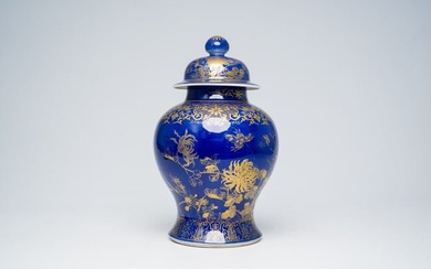 A Chinese powder blue and gilt vase and cover with floral design, 19th C.