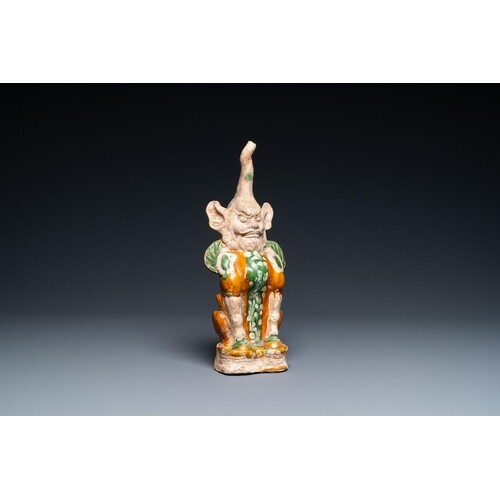 A Chinese sancai-glazed pottery 'earth spirit' figure, TangD...
