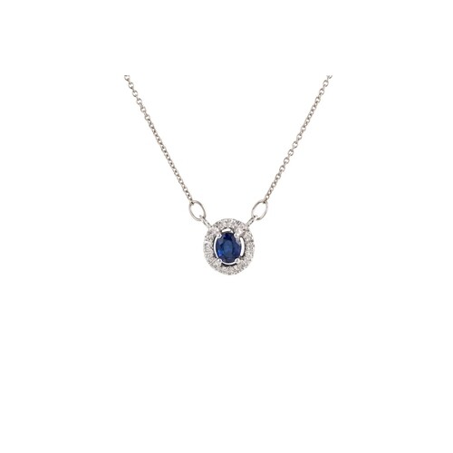 A DIAMOND AND SAPPHIRE CLUSTER PENDANT, of oval form, mounte...