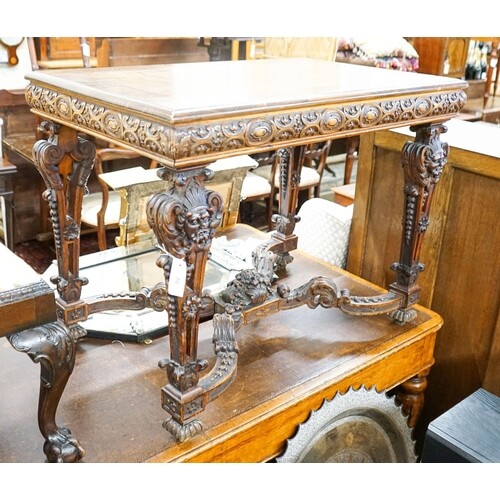 A Flemish carved walnut and beech centre table, width 100cm,...