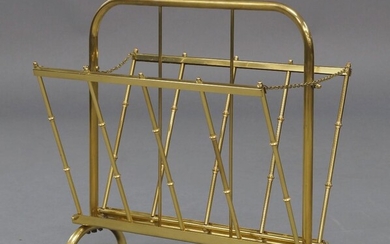 A French brass folding magazine rack, circa 1960, with folding sides on curved supports, 43cm high, 44cm wide, 26cm deep