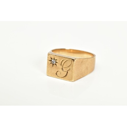 A GENTLEMANS 9CT GOLD SIGNET RING, designed with a square wi...