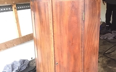 A Georgian mahogany bowfronted hanging corner cabinet with dentil inlaid...