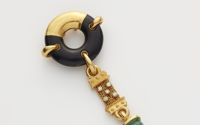 A German 18k gold ebony disc diamond and emerald pendant.