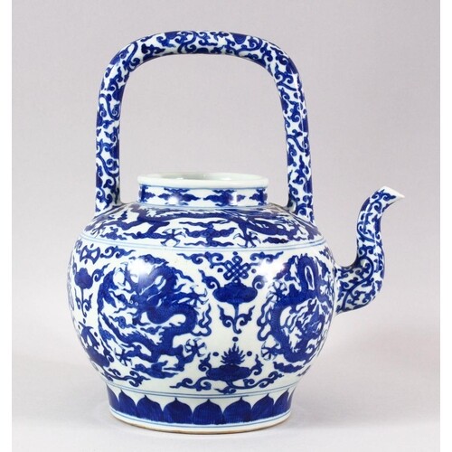 A LARGE CHINESE BLUE AND WHITE TEA POT, painted with roundel...