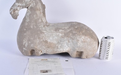 A LARGE CHINESE HAN DYNASTY GREY POTTERY FIGURE OF A HORSE C...