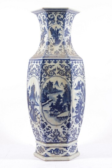 A Large Hexagonal Chinese Blue And White Vase, Decorated With Flowers And A River Scene (H:63cm)