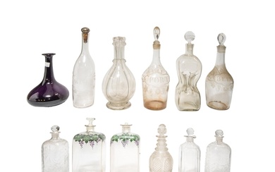 A MIXED GROUP OF ELEVEN VINTAGE GLASS DECANTERS, the lot inc...