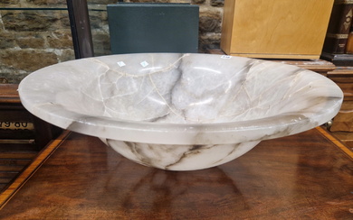 A MOTTLED GREY ALABASTER CEILING DISH, THE BOWL SHAPE WITH SUSPENSION HOLES IN THE FLATTENED RIM.