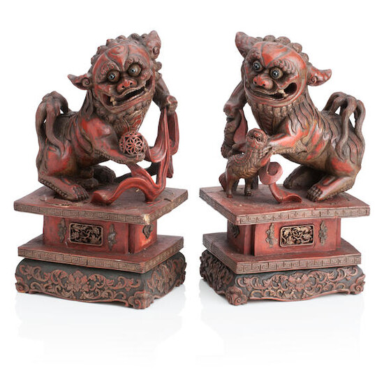 A PAIR OF CHINESE CARVED WOOD AND LACQUER BUDDHIST LION DOGS