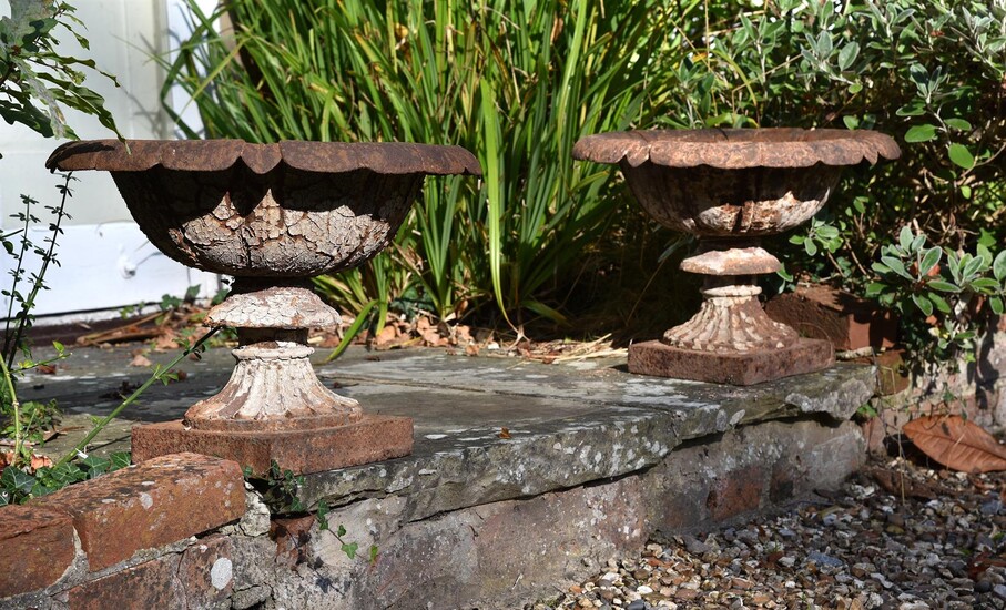 A PAIR OF VICTORIAN CAST IRON TERRACE URNS, IN THE MANNER OF THE HANDYSIDE FOUNDRY, 19TH CENTURY
